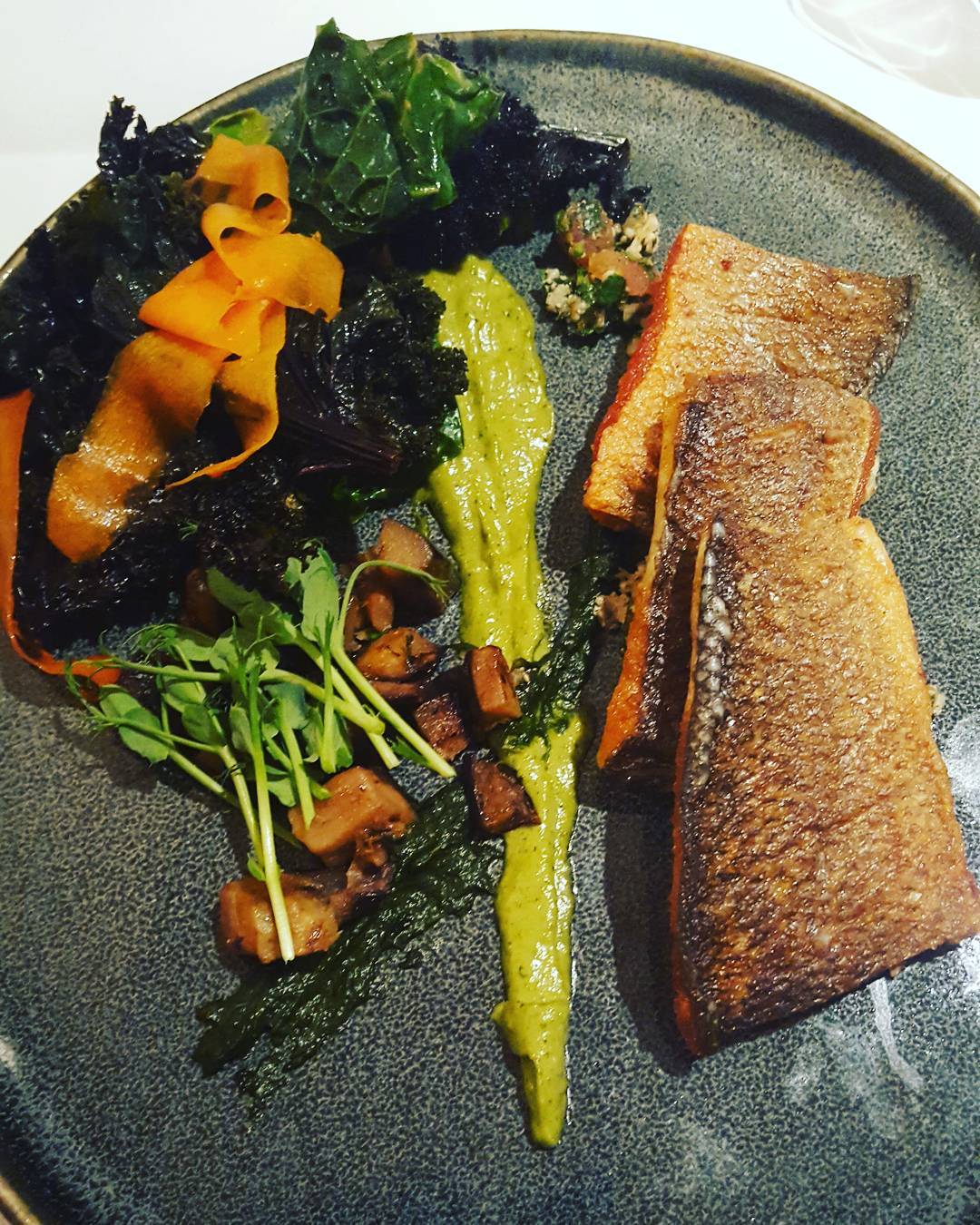 Fillet of Seabass with cavolo nero , cauliflower tabouleh, and aubergine caponata and mixed vegetables.

Healthy good fats in the seabass with crispy skin -yum! 
A smear of aubergine puree and cauilflower couscous and crispy cavolo nero.
The carrot is sliced and cooked together with cabbage and kale. Mixed together with some Moroccan style spices.

vegetables