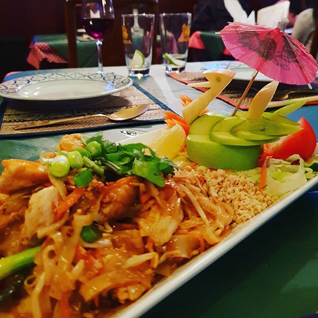 Pad Thai dinner served up with a swan decoration made from apples. 
One of my favourite Thai dishes of rice noodles, bean shoots, chopped peanuts, king prawns, and lime juice, chillies, fish sauce, galangal, coriander, Thai basil and a tiny pinch of palm sugar to flavour.