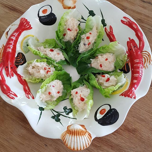 Crab in lettuce shells 

Crab mixed with creme fraiche,chopped chilli, spring onion, salt and pepper 
In lettuce shells.