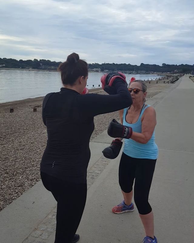 When boxing with a very pregnant personal trainer it's important to keep focused! 
Early morning training on the beach.
Boxing is great for core strength, stamina, arms, upperbodyworkout.

sixtyplus