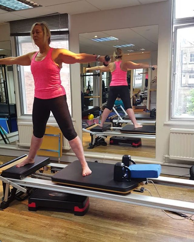 Back in the pilates studio 
This exercise engages core, helps spinal mobility, hip flexors, balance, gluteals and flexibility.
It is much harder than it looks as it also requires the reformer to be held out and stay in place and still whilst bending over and twisting